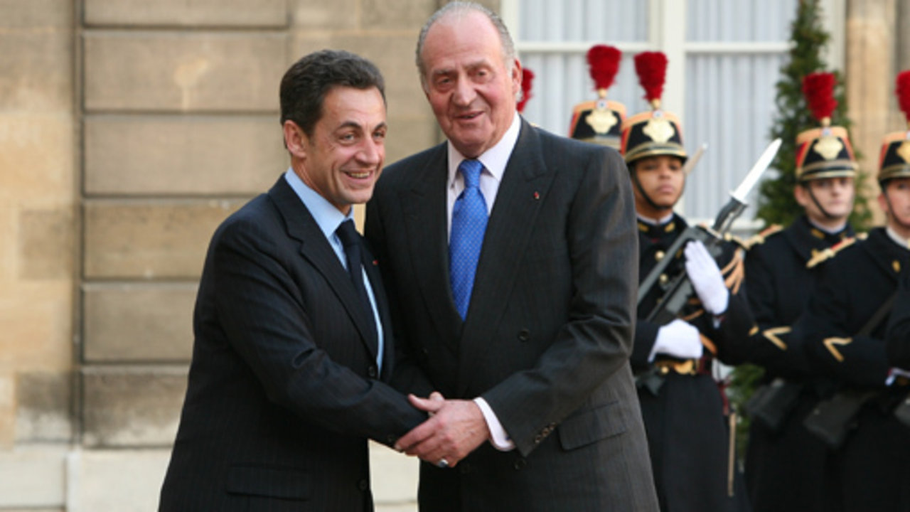 El rey y Nicolas Sarkozy.